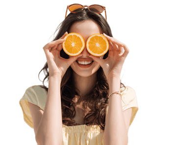 Young woman having fun with orange slices, representing health, freshness, and joy.