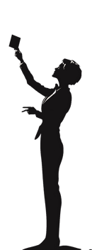 Silhouette of a person holding something up high.