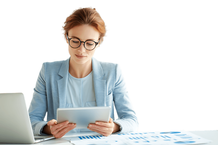 Businesswoman reviewing data on digital tablet for analysis and strategy.