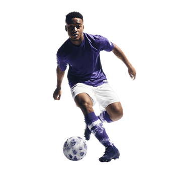 Soccer player dribbling with skill and precision.