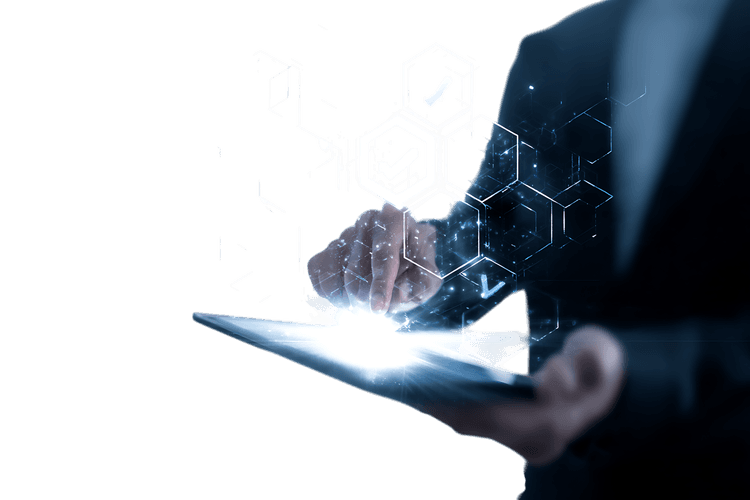 Businessperson using digital tablet with holographic interface.