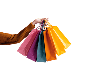 Colorful shopping bags held in a hand against a black background.