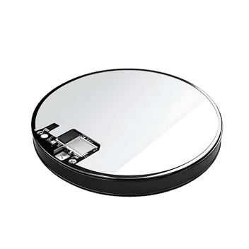 Close up of a sleek, circular technological device.