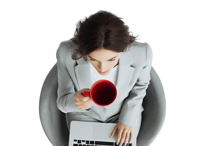 Businesswoman working on laptop, enjoying coffee break.