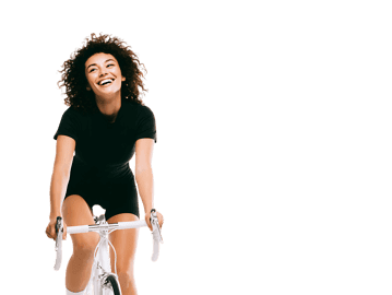 Smiling woman enjoys cycling, promoting health, fitness, and freedom.