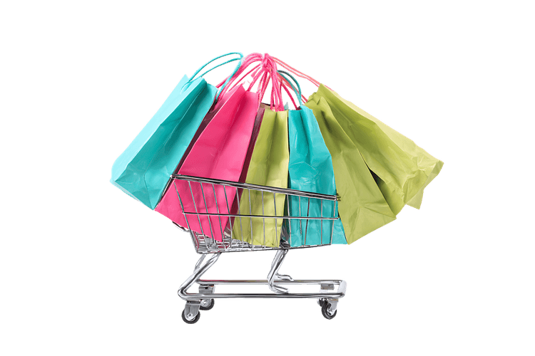 Colorful shopping bags in a small shopping cart