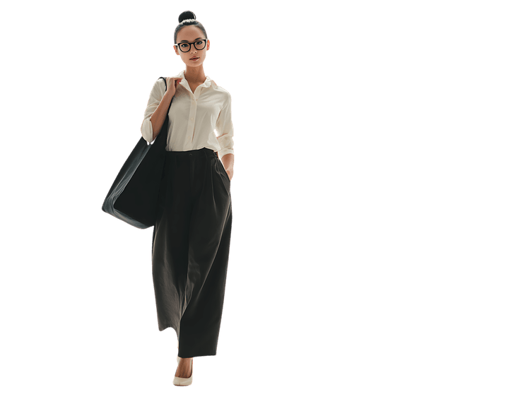 Stylish businesswoman walking, embodying confidence and professionalism.