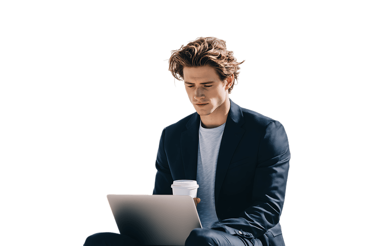 Focused young businessman working on laptop outside.